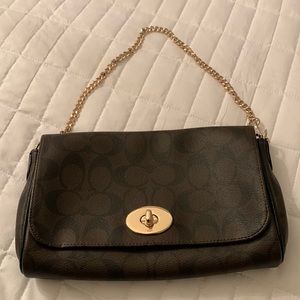 Coach purse. Brown and black. Gold hardware.  Never used. NWOT